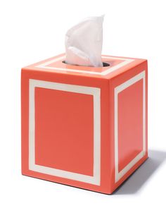 a tissue dispenser in an orange box with white trim on the sides