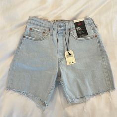 Levi’s Denim Short Size 27 Hi Rise Relaxed Through The Hip And Thigh Hits At Mid Thigh 99% Cotton, 1% Elastane Tags Still On/Never Worn Medium Wash Five-pocket Jean Shorts, Medium Wash Jean Shorts With Five Pockets, Short Leg Denim Blue Jeans, Mid-rise Five Pocket Summer Shorts, Mid-rise Five-pocket Summer Shorts, Denim Blue Short Leg Jeans, High Rise Denim Blue Shorts With Five Pockets, Light Wash Shorts With Five Pockets, Light Wash Relaxed Fit Short Jeans