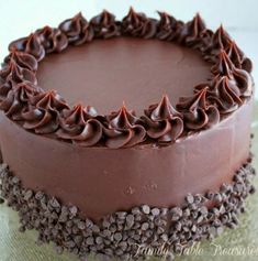 a chocolate cake is sitting on a plate