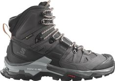 a pair of black hiking boots on a white background