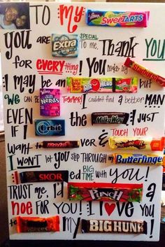 a white board with many different words on it and candy bar wrappers attached to it