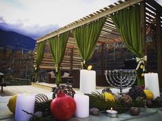 an outdoor area with candles and decorations