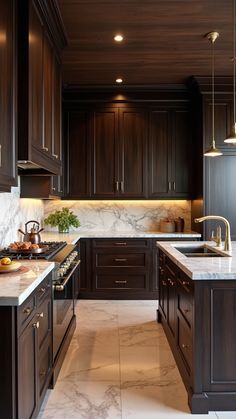 a kitchen with marble counter tops and dark wood cabinets