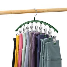 a rack with several pairs of pants hanging from it