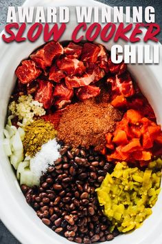 the award winning slow cooker chili recipe in a bowl with beans, peppers and other ingredients