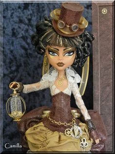 the doll is wearing a brown dress and hat