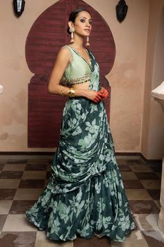 Emerald green attached cancan lehenga saree with floral print and shell embroidered border. Paired with metal sequin, multicolored stone embellished ruched padded blouse. - Aza Fashions V Neck Lehenga, Tiered Lehenga, Cancan Lehenga, Printed Lehenga, Padded Blouse, Indian Wedding Wear, Embroidered Border, Lehenga Saree, Blouse For Women