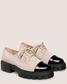 NOLITA LACE-UP OXFORD | Stuart Weitzman Elegant Cap Toe Lace-up Shoes For Spring, Elegant Spring Cap Toe Lace-up Shoes, Elegant Spring Lace-up Cap Toe Shoes, Classic Pointed Toe Oxfords With Contrast Sole, Spring Derby Cap Toe Leather Shoes, Cap Toe Oxfords With Contrast Sole, Cap Toe Lace-up Shoes With Contrast Sole For Work, Spring Cap Toe Oxfords With Leather Sole, Spring Oxfords With Contrast Sole For Derby