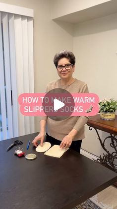 an older woman is making homemade slippers on the table