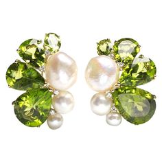 A pair of peridot, pearl and diamond earrings, set with eight graduating pear shaped peridots, with a total weight of 39.75ct, six cultured and baroque pearls, with a total weight of 34.55ct and eight, round brilliant-cut diamonds, with a total weight of 0.17ct, between the pearls and peridots, at intervals, mounted in 18ct yellow gold. Modern Diamond Earrings, Diamond Gold Earrings, Everyday Earrings Studs, White Diamond Earrings, Butterfly Earrings Gold, Vintage Stud Earrings, Diamond Cluster Earrings, White Gold Earrings Studs, Peridot Jewelry