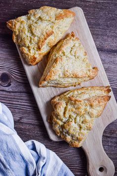 three pieces of scones on a cutting board