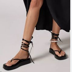 Uo - Strappy Tie Up Black Sandal Brand New Black Toe Post Wedge Sandals For Spring, Black Toe Post Flip Flops For Beach Season, Black Single Toe Strap Sandals For Beach Season, Black Beach Season Sandals With Single Toe Strap, Black Sandals With Single Toe Strap For Beach Season, Black Toe Post Wedge Sandals For Summer, Black Toe Post Wedge Sandals For Beach Season, Black Toe Post Wedge Sandals For Vacation, Adjustable Black Flip Flops For Summer