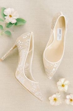 wedding shoes and flowers on a table