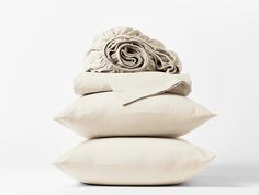 three pillows stacked on top of each other