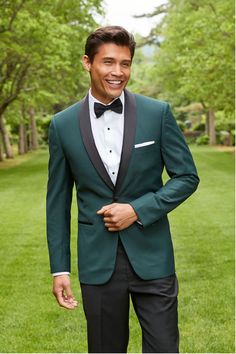 The Green Shawl Tuxedo Jacket is crafted from an ultra soft Luxury Viscose Blend. This luxurious green jacket features a stunning green color contrasted by black satin peak lapels that make this a modern show-stopper of a look, great for any occasion. MATCHING PANTS: The pants that were designed to go with this jacket are the Black Tuxedo Pants. Fitted Green Sport Coat For Semi-formal Occasions, Emerald Green Wedding Groomsmen, Green Single Breasted Suit For Party, Tailored Green Winter Suit, Green Winter Party Suit, Winter Party Green Suit, Formal Green Outerwear With Suit Collar, Green Formal Outerwear With Suit Collar, Fitted Green Sport Coat With Long Sleeves