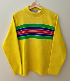 Vintage Ski Country Colorado Knitting Mills 100% Virgin Wool Pull Over Sweater / Unisex Knit Sweater Size M / Vibrant Yellow & Striped *Retro ski sweater.  *In great vintage condition. *Quality knit clothing made in Colorado. *Clean and warm. *100% Wool. *Please refer to photos. *Measurements:   Size M   Shoulder to shoulder seam 16"   Arm pit to arm pit seam 21"   Sleeve length with cuff turned up 24"   Length 26" *If you have any questions please message.    Thank you! 70s Sweater, Knit Clothing, Retro Yellow, Retro Ski, Pull Over Sweater, Ski Sweater, Vintage Ski, Yellow Stripes, Knit Outfit