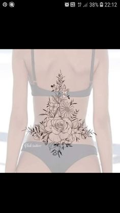 an image of a woman with flowers on her stomach and the back of her panties