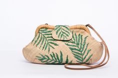 The Palm Leaves Signature Larone purse is your "happy" bag! And one that has a happy story to tell too! The body material is woven by women weavers, wives of fishermen and farmer who supplement the family income through their weaving. Each daisy is embroidered with sustainable, all-natural raffia fibers by women in urban areas who work from home as they take care of their family. Cue happy sigh and smile! - Measurements: 12" width x 3" depth x 7" height, leather strap 19" drop - Body: 100% raffia, Lining: 100% polyester, Frame: 100% rattan, strap: 100% cow leather - Made in the Philippines in our own atelier in collaboration with weavers and artisans - Free shipping anywhere in the USA From the time my mother began her little workshop for handbags over 35 years ago, we have stayed true to Embroidered Natural Straw Travel Bag, Natural Embroidered Straw Bag For Daily Use, Eco-friendly Handwoven Clutch For Everyday Use, Embroidered Natural Shoulder Bag For Travel, Handwoven Natural Clutch Shoulder Bag, Handwoven Natural Color Clutch Shoulder Bag, Natural Handwoven Clutch Shoulder Bag, Traditional Handwoven Clutch Bag, Traditional Embroidered Natural Color Bag