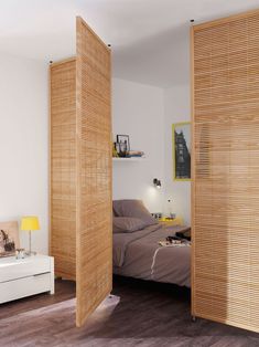 a bedroom with wooden slats on the walls