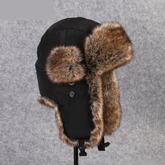 You will love this unisex bomber which is made of acrylic fibre and fur for the middle-aged youth. The Russian ushanka ear protection cap will give you great protection from cold during winter. This unisex faux trapper hat has a solid pattern and is in an all-time favorite black color with a shade of brown.

Specifications
Brand Name: GeraldBlack
Gender: Unisex
Department Name: Adult
Pattern Type: Solid
Item Type: Bomber Hats
Model Number: B-8526
Material: Fur
Applicable object: Middle age youth Black Hats With Plush Lining For Cold Weather, Black Hat With Faux Fur Lining And Ear Flaps, Black Hats With Plush Lining And Ear Flaps, Black Aviator Hat For Outdoor, Black Insulated Winter Hat, Insulated Black Winter Hat, Russian Ushanka, Fur Trapper, Fur Trapper Hat