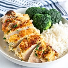 a white plate topped with chicken and rice next to broccoli