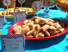 there is a plate of food on the table with place cards for people to eat