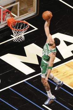 a basketball player dunking the ball into the hoop