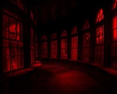 an empty dark room with red light coming from the windows and floor to the ceiling