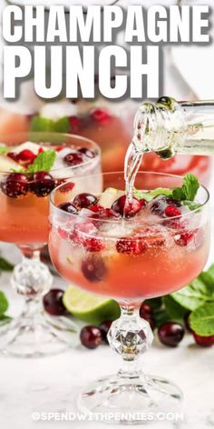 cranberry champagne punch is garnished with mint and lime