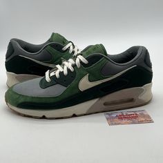 Introducing a stylish and premium pair of Nike Air Max 90 sneakers in a stunning green and grey colorway. These sneakers are made with high-quality mesh upper material, ensuring both breathability and durability. The shoe size is 14 and it is designed specifically for men. The Nike Air Max 90 model has been a fan favorite since its release in 1999, and this 2022 version is no exception. With its sleek design and comfortable fit, these sneakers are perfect for both athletic and casual wear. The style code is DH4621-300 and the product line is Nike Air Max. Don't miss out on adding these sneakers to your collection! No box Green Breathable Lace-up Custom Sneakers, Green Dynamic Lace-up Running Shoes, Dynamic Green Lace-up Running Shoes, Custom Green Sneakers With Breathable Round Toe, Green Synthetic Sporty Running Shoes, Green Breathable High-top Custom Sneakers, Dynamic Green Sneakers With Cushioned Footbed, Green Fade-resistant Mesh Sneakers, Green Nike Air Max With Air Max Cushioning