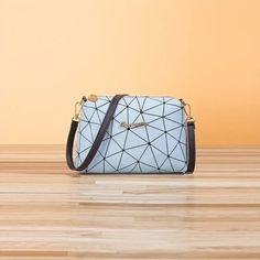 Elevate Your Fashion Game With This Trendy And Stylish Crossbody Bag. The Geometric Pattern Adds A Touch Of Sophistication To Any Outfit, While The Blue Exterior Color Is Both Versatile And Eye-Catching. The Zipper Closure Ensures The Safety Of Your Belongings In This Spacious Bag, Perfect For Everyday Use. Crafted From High-Quality Materials, This Bag Includes Chic Accents Such As A Prominent Zipper For Added Flair. Ideal For Women On-The-Go, This Crossbody Bag Is Perfect For Carrying All Your Geometric Evening Bag, Light Blue Shoulder Bag With Zipper Closure, Blue Exterior, Trendy Handbags, Stylish Shoulder Bag, Mini Fashion, Fashion Games, Coin Purse, Crossbody Bag