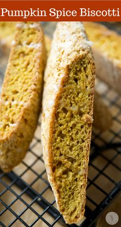 two slices of pumpkin spice biscotti on a cooling rack with text overlay