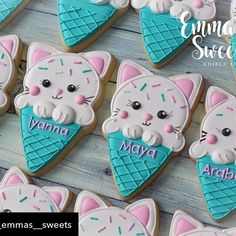 decorated cookies with cats and ice cream cones on a wooden table for someone's sweetest birthday