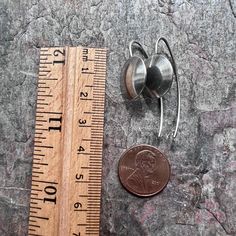 These minimalist dangle earrings are created entirely from solid sterling silver. I have cut two circles from a sheet of pure sterling silver. The circles were then lightly domed and lightly textured. The circles are soldered to curved sterling silver earwires. The silver has been oxidized and polished to create an antique patina finish.Be sure to see all photos and video for size and color reference.Circles measure about 5/8 of an inch.Total Earring Length from the top of the earwire to the bot Minimalist Hammered Sterling Silver Linear Earrings, Nickel-free Minimalist Round Linear Earrings, Nickel-free Minimalist Linear Earrings, Minimalist Nickel-free Round Linear Earrings, Modern Silver Round Disc Earrings, Minimalist Silver Round Pendant Earrings, Modern Nickel-free Round Disc Earrings, Modern Sterling Silver Round Disc Earrings, Minimalist Sterling Silver Round Disc Earrings