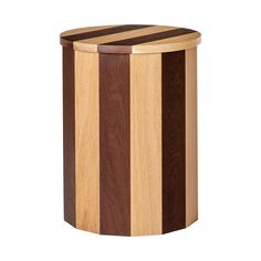 a wooden trash can sitting on top of a white floor next to a black and brown stripe