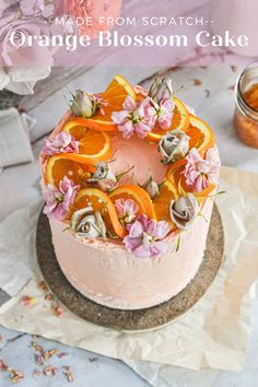 an orange blossom cake with flowers on top