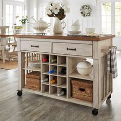 a white kitchen island with baskets on it