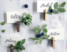 four pieces of paper with leaves and name tags attached to clothes pins that say italian