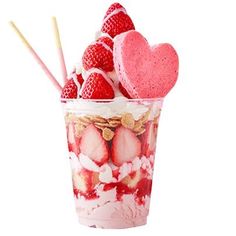 strawberry shortcakes and ice cream in a cup with strawberries on the side