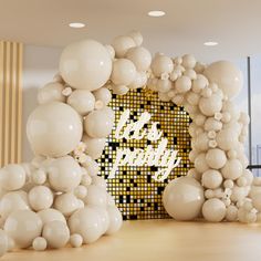 a room filled with balloons that say happy on the wall and white balloons floating in the air