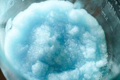 the inside of a blender filled with blue and white powdered sugar cubes