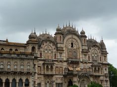 an old building with many windows and towers