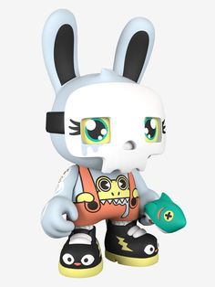 a white and black bunny with green eyes is holding a toy in its hand,