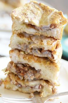 a stack of food sitting on top of a white plate