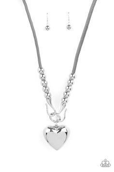 Featuring chunky silver beads, an oversized silver heart pendant swings from dramatic silver hook-like fittings that attach to a bold gray leather cord draped across the chest for a haute heartbreaker look. Features an adjustable clasp closure. Sold as one individual necklace. Includes one pair of matching earrings. P2WH-SVXX-337XX Puffy Heart Necklace, Silver Necklace Set, Forbidden Love, Silver Heart Pendant, Silver Heart Necklace, Puffy Heart, Paparazzi Accessories, Gray Leather, Love Necklace