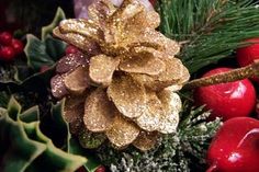 a pine cone is sitting on top of some christmas decorations