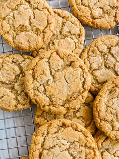 a pile of cookies sitting on top of a cooling rack