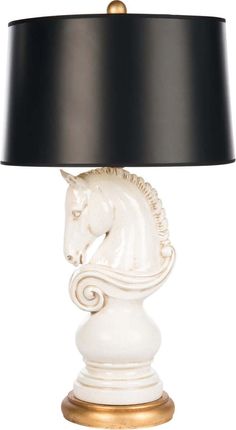 a white table lamp with a horse head on it's base and a black shade