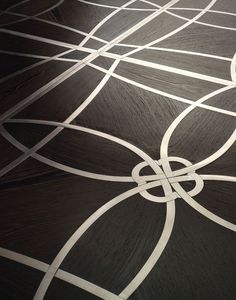 an abstract design is shown on the floor in this image, it appears to be made out of wood