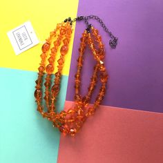 Bright orange beads in a mixed shape pattern make up this juicy statement necklace. This 3 strand statement necklace style is known as the Morgan Necklace. Beads were made in the 1960's. Necklace measures 15.5-16" at it's shortest + a 6" extender. Lightweight and fun to wear: a classic style that will outlast trends. Model is wearing the same style in another color-way so you can see this piece styled when worn. Most all jewelry is hand finished & designed here in the US. Most all jewelry pa Luxury Handmade Orange Necklaces, Hand-strung Orange Beaded Necklace, Unique Hand-strung Orange Necklace, Orange Multi-strand Polished Beaded Necklaces, Vintage Orange Hand-strung Beaded Necklace, Orange Multi-strand Polished Beaded Necklace, Necklace Beads, The Morgan, Same Style